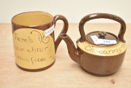Two pieces of 19th century Scottish Cumnock pottery comprising mug and teapot, each decorated with