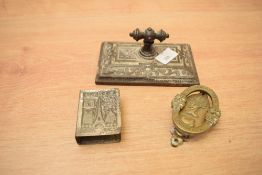 A small collection of curios including seal, match holder and knocker.