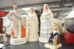 A group of four Staffordshire flat back figures/figurines to include the Prince of Wales, largest