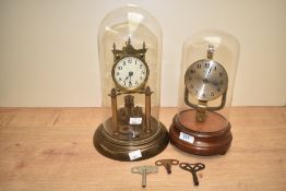 Two vintage brass 400 day clocks, both having glass domes