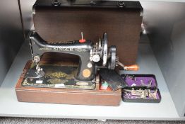 A vintage Singer sewing machine, model number EA576161, complete with case.