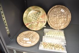 A polished limestone solitaire game, w20.5cm, sold together with a onyx solitaire game ect, (3)