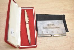 An Elizabeth II silver card holder, of hinged rectangular form with hinged personalised engraving to