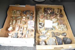 A large assortment of mineral samples, collected nationally and internationally, including garnet,