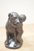 A Heredities style figure group depicting boy and dog, measures 14cm tall.