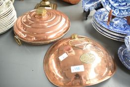 A 19th/early 20th century copper 'Tummy warmer' of convexed oval form, having brass ring handle