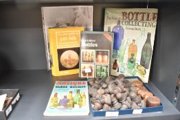 A selection of vintage bottle stoppers and bungs sold alongside books on bottling collecting etc.
