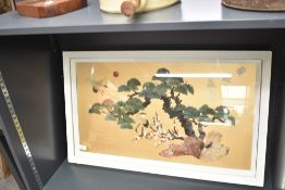 A decorative 20th century Chinese carved stone sample artwork, rocky outcrop with tree, blossoms and