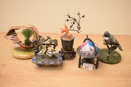 A small group of decorative vintage Chinese cloisonné animals featuring two birds under a tree