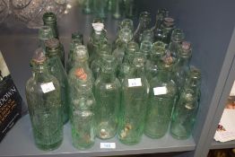 A selection of twenty nine antique glass Codd necked bottles including names Charles Samson Bolton