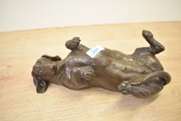 A heavy resin Daschund study depicted laid on it's back, having Doris Lidner signature to rererse,