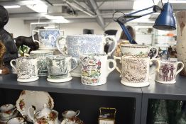 A group of nine Victorian English pottery mugs and loving cups, largest measures 18cm tall, to