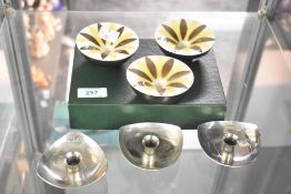 A group of three Royal Copenhagen 'Aluminia Faience' hand painted candle holders sold alongside