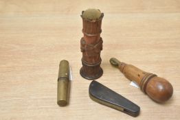 A vintage bone handled multi-tool sold alongside a steel pocket corkscrew, a carved treen needle