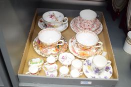 A Royal Crown Derby bone china Rougemont pattern trio, printed puce factory marks to base, sold