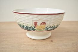 An antique Scottish Spongeware bowl having cockerel motifs to edge, diameter measures 20cm.