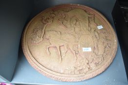 A circular Chinese style wall hanging plaque depicting a traveller returning home from his journey
