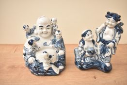 Two blue and white ornamental figures, Buddah etc