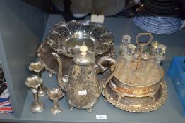 A selection of silver-plated ware including, cruet set, coffee pot, and candlesticks etc.