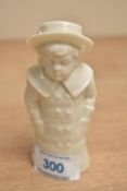 A Royal Worcester fine bone china figurral pepperette depicting a young boy in coat and hat,