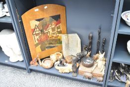 A large assortment of carved wooden items including bison, multiple elephants and a novelty sized