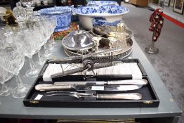 An early 20th century leather bound suitcase in mid brown textured leather with stitched corners.