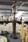 A reproduction table lamp in the form of a street lantern, h75cm