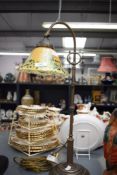 An attractive brass adjustable column reading/ table lamp, having polychrome mottled glass shade,