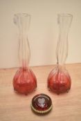 A pair of cranberry to clear glass vases of waisted form, h25.5cm