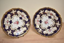 Two Royal Crown Derby bone china floral, gilt and cobalt decorative plates, having solid gilt