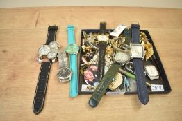 An assortment of costume jewellery, including wristwatches, statement pieces, an enamelled bird