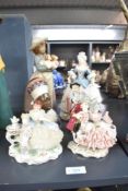 A Nao by Lladro porcelain figurine 'What An Armful' model number 1156 sold together with a group