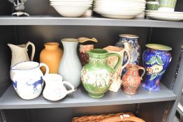 A miscellaneous selection of pottery vases and jugs to include a Poole Pottery cream jug etc.
