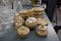 A polished limestone dish with cover, w15cm, sold together with various similar trinkets, and a