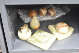 A group of eight vintage onyx items including ashtray, eggs and lighter etc.