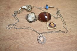 A small assortment of costume and silver jewellery, including an agate set brooch, a silver