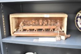 A Bavarian wood carving 'The Last Supper' from Oberammergau C.1952, sold alongside a small Corpus