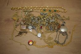 An assortment of costume jewellery, including brooches, statement pieces and neck chains