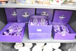 A group of eight Edinburgh crystal champagne flutes, all boxed.