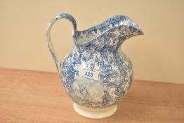 A Scottish Spongeware blue and white ceramic pitcher/jug, measures 18cm tall.