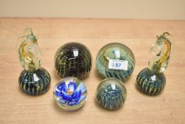 A pair of Mdina Maltese glass seahorse paperweights both damaged, sold alongside four glass