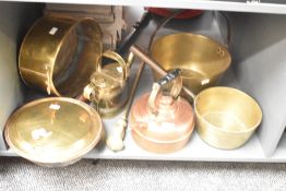 An assortment of brass and copper ware to include a watering can in the style of Dr Christopher