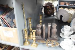 A pair of wooden bookends , owl themed, and a selection of brass ware including candlesticks and