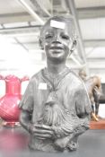A table top sculpture of an African boy with chicken, h33.5cm