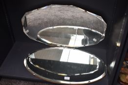 A 20th century oval mirror, w66cm, sold together with 1 other
