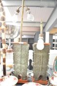 A pair of impressive Chinese cast bronze vessels later converted to table lamps decorated in the