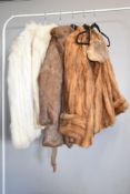 Four vintage fur jackets to include ice grey, brown, tan, and a cream with taupe leather panelling