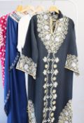 Three traditional women's Thoub, to include Syrian examples, one navy blue, the other black, both