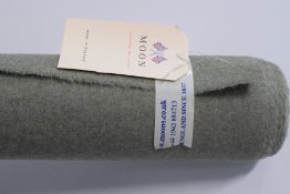 A bolt of Abraham Moon & Sons 100% pure wool in Earth Willow colour, a neutral sage green with
