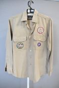 A 1970s Scout Leader's Terylene shirt in beige cotton work-wear fabric, two breast pockets, with